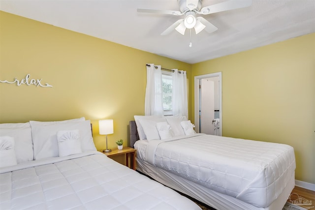 bedroom featuring wood-type flooring and ceiling fan