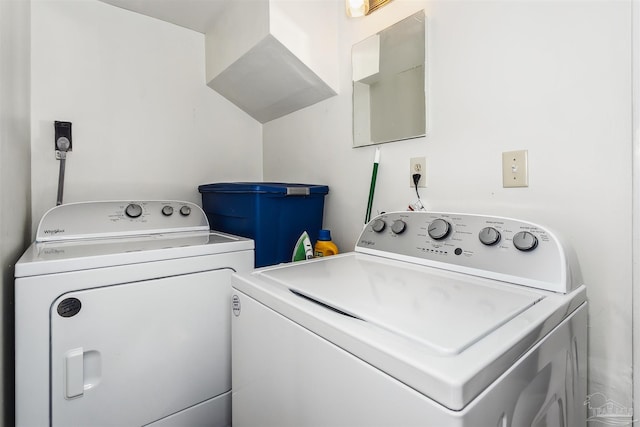 laundry area featuring washing machine and clothes dryer