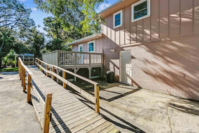 exterior space featuring a trampoline and a deck