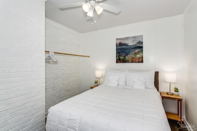 bedroom featuring crown molding, brick wall, ceiling fan, and wood-type flooring