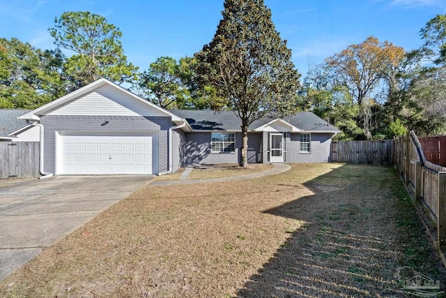 ranch-style home featuring a front lawn and a garage