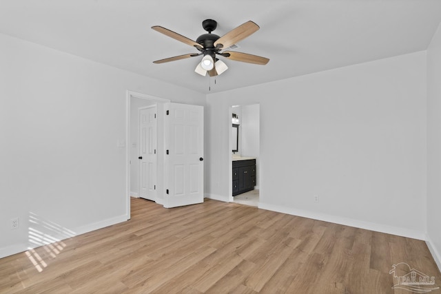 empty room featuring light wood-type flooring and ceiling fan