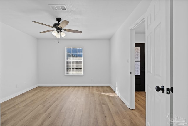 unfurnished room featuring light wood-type flooring and ceiling fan