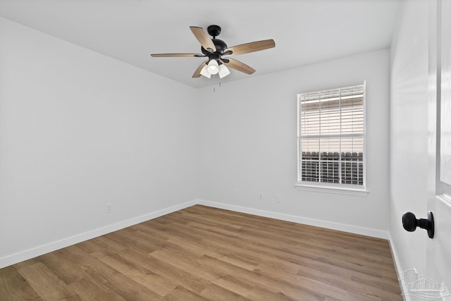 spare room featuring ceiling fan and light wood-type flooring