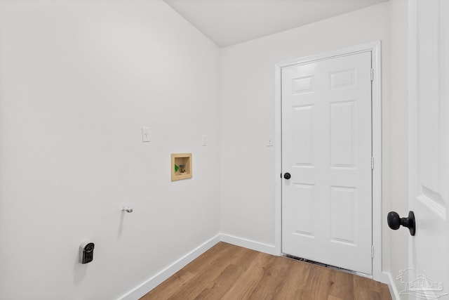 clothes washing area with washer hookup and light hardwood / wood-style flooring