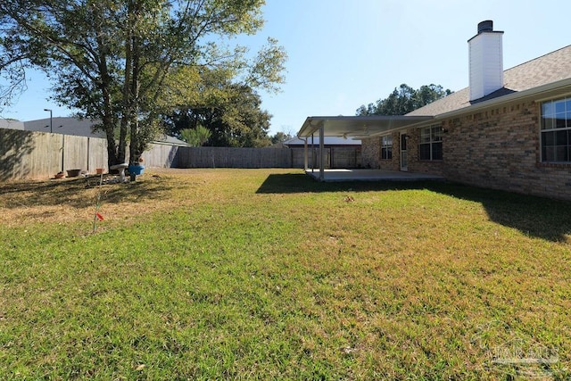 view of yard featuring a patio and a fenced backyard