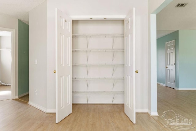 closet featuring visible vents