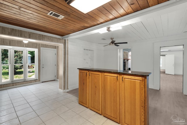 4881 Calvin Dr, Milton, FL 32583 - kitchen featuring baseboards, crown molding, wood ceiling, light tile patterned flooring, and a center island