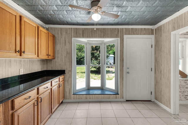 4881 Calvin Dr, Milton, FL 32583 - kitchen featuring crown molding, an ornate ceiling, baseboards, a ceiling fan, and light tile patterned floors