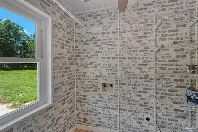 4881 Calvin Dr, Milton, FL 32583 - washroom featuring hookup for an electric dryer and brick wall