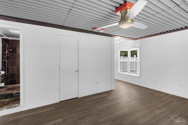 4881 Calvin Dr, Milton, FL 32583 - garage featuring baseboards and a ceiling fan