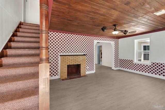4881 Calvin Dr, Milton, FL 32583 - exterior space with wood finished floors, wooden ceiling, ornamental molding, ceiling fan, and a tiled fireplace