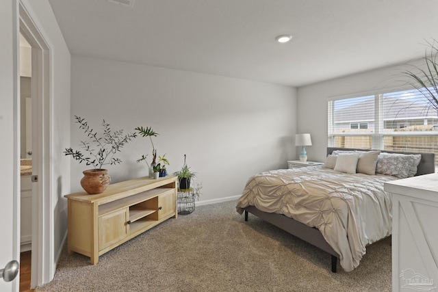 bedroom with carpet and baseboards