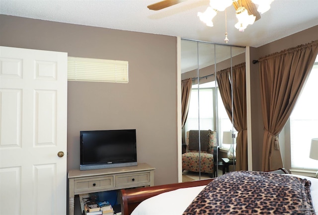 bedroom featuring a closet and ceiling fan