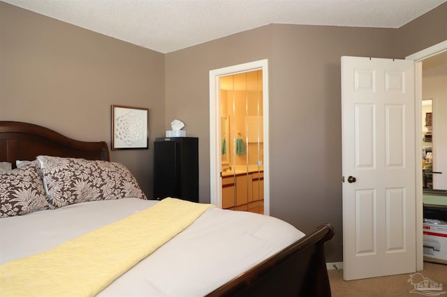 carpeted bedroom featuring connected bathroom