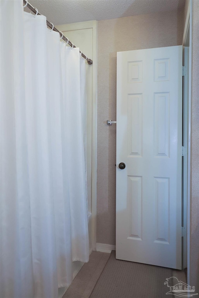 bathroom featuring tile patterned flooring