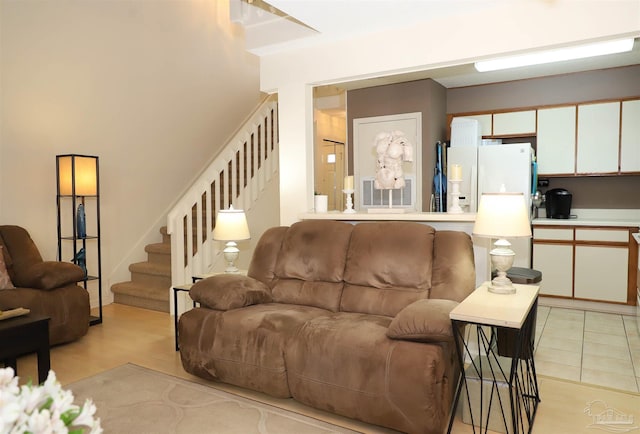 living room with light tile patterned floors