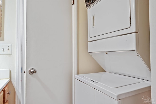 laundry room featuring stacked washing maching and dryer