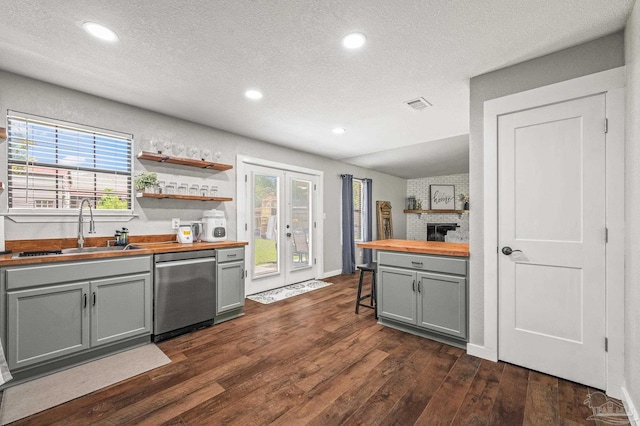 4684 Evelyn St, Pace, FL 32571 - kitchen featuring butcher block counters, dishwasher, a sink, gray cabinetry, and dark wood-style floors
