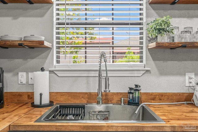 4684 Evelyn St, Pace, FL 32571 - kitchen view of a sink and a textured wall