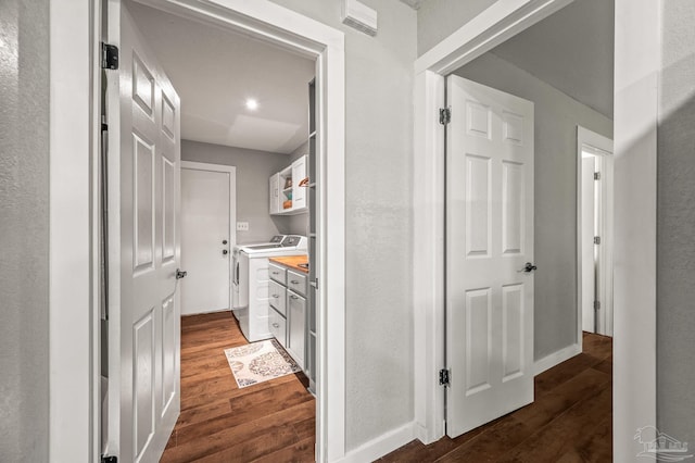 4684 Evelyn St, Pace, FL 32571 - hallway featuring washing machine and clothes dryer, dark wood-style flooring, and baseboards
