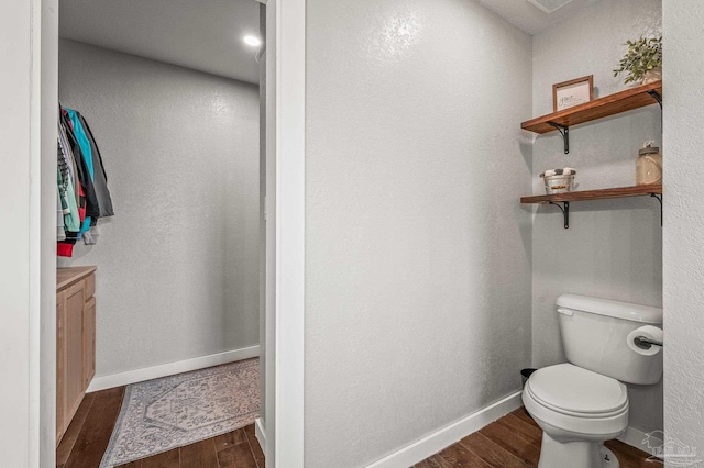 4684 Evelyn St, Pace, FL 32571 - bathroom featuring wood finished floors, toilet, and baseboards