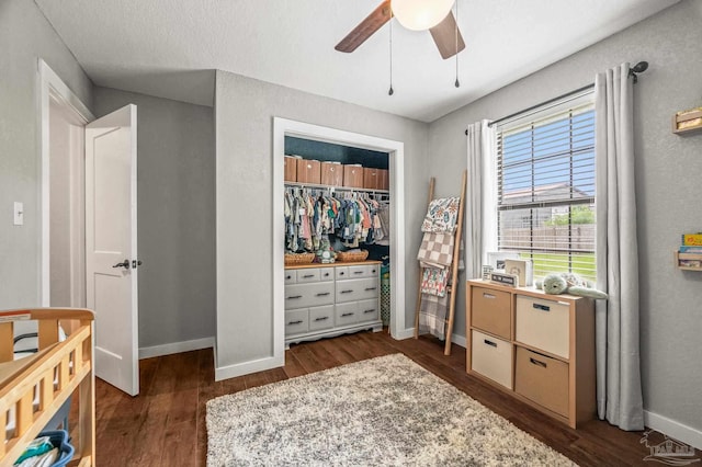 4684 Evelyn St, Pace, FL 32571 - bedroom with dark wood-style flooring, baseboards, a ceiling fan, and a closet