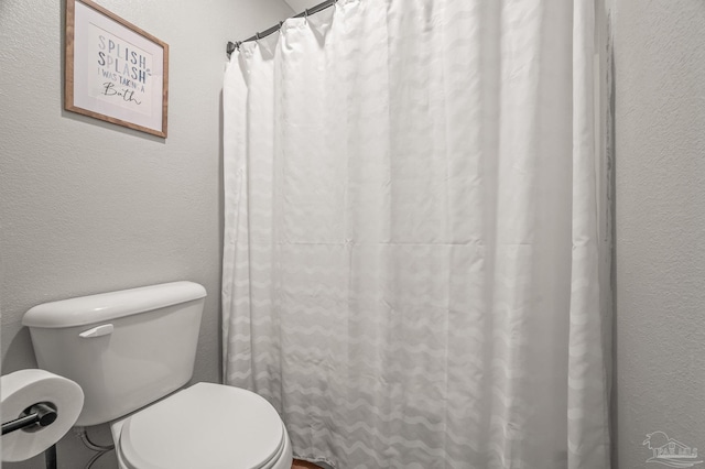 4684 Evelyn St, Pace, FL 32571 - full bathroom featuring a textured wall and toilet