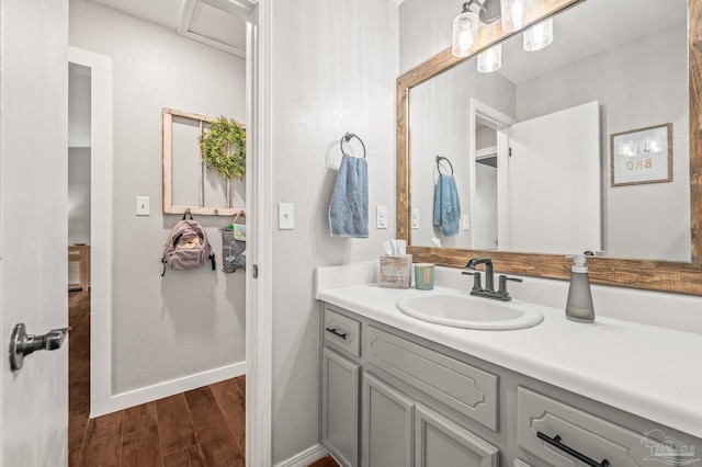 4684 Evelyn St, Pace, FL 32571 - bathroom with wood finished floors, vanity, and baseboards