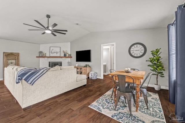4684 Evelyn St, Pace, FL 32571 - living area with ceiling fan, vaulted ceiling, dark wood-style floors, a fireplace, and baseboards