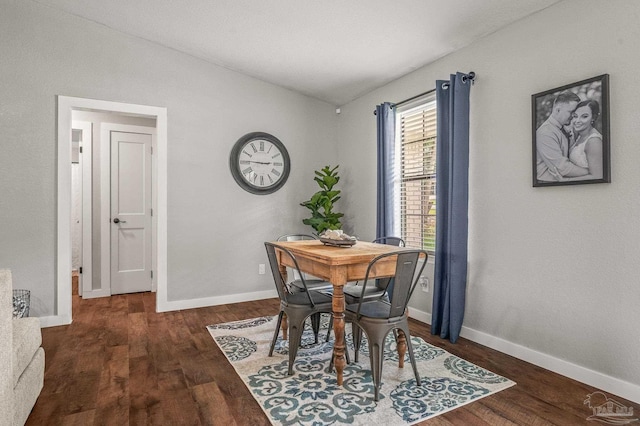 4684 Evelyn St, Pace, FL 32571 - dining space featuring lofted ceiling, wood finished floors, and baseboards