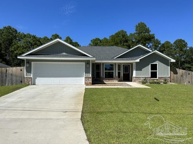 view of front facade with a garage and a front yard