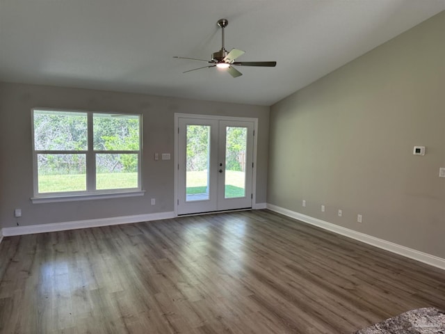 unfurnished room featuring ceiling fan, french doors, hardwood / wood-style flooring, and lofted ceiling