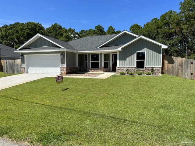 view of front facade featuring a garage and a front lawn