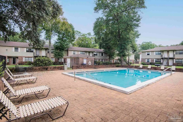 view of swimming pool with a patio