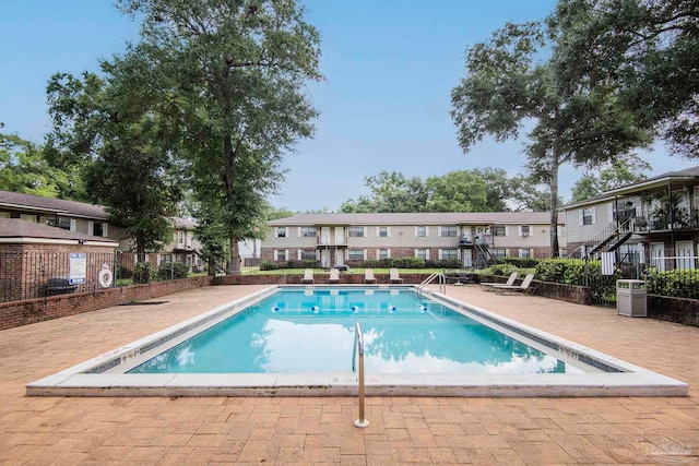 view of pool featuring a patio area