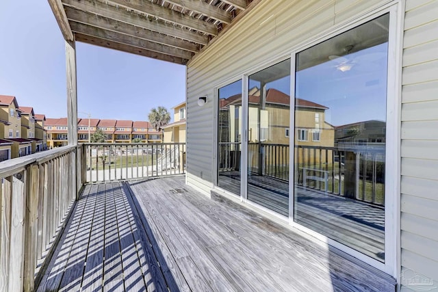 wooden deck with a residential view