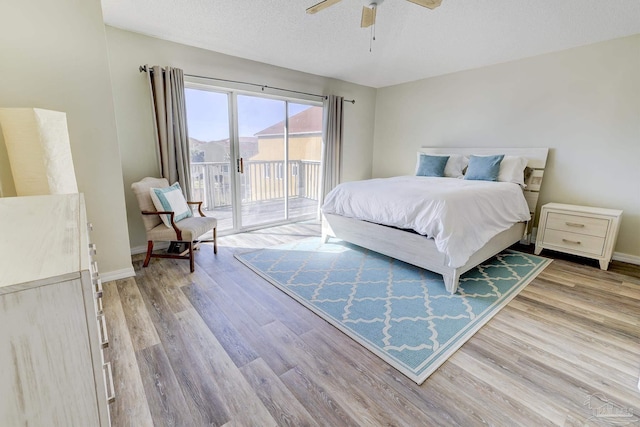 bedroom featuring baseboards, ceiling fan, access to exterior, a textured ceiling, and light wood-type flooring