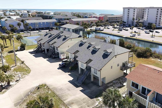 bird's eye view with a water view and a residential view