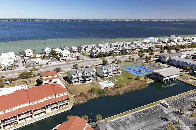 drone / aerial view featuring a residential view and a water view