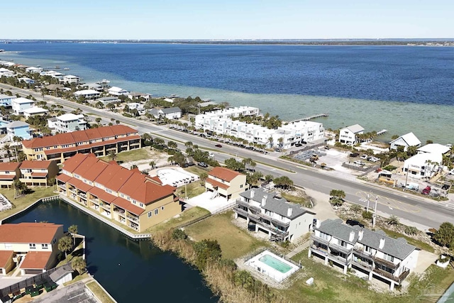 aerial view featuring a residential view and a water view