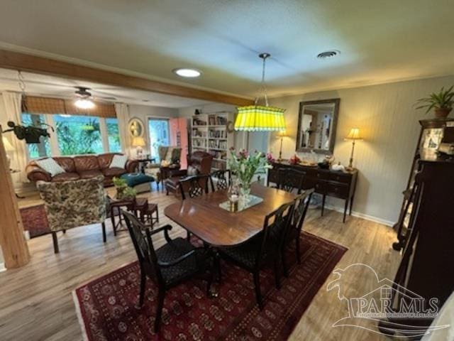 dining room with ceiling fan and light hardwood / wood-style flooring