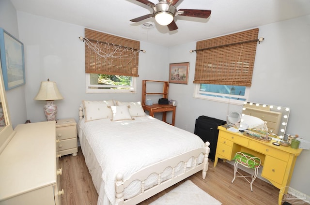 bedroom featuring light hardwood / wood-style flooring and ceiling fan