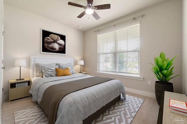 2748 Woodman Loop, Cantonment, FL 32533 - bedroom with light colored carpet, baseboards, and ceiling fan
