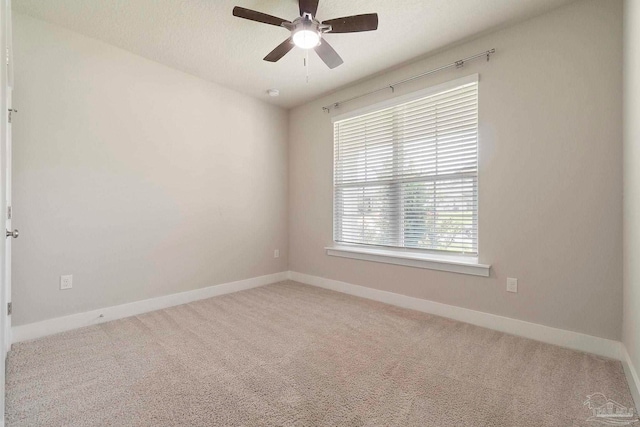 2748 Woodman Loop, Cantonment, FL 32533 - empty room featuring baseboards, ceiling fan, and carpet floors