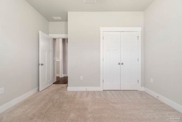 2748 Woodman Loop, Cantonment, FL 32533 - unfurnished bedroom featuring carpet floors, a closet, and baseboards