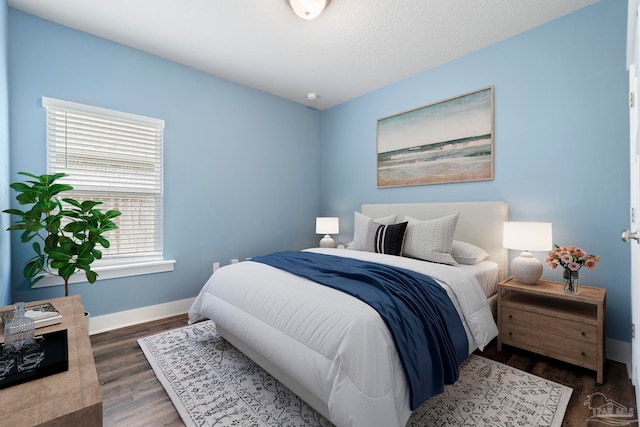 2748 Woodman Loop, Cantonment, FL 32533 - bedroom featuring baseboards and wood finished floors