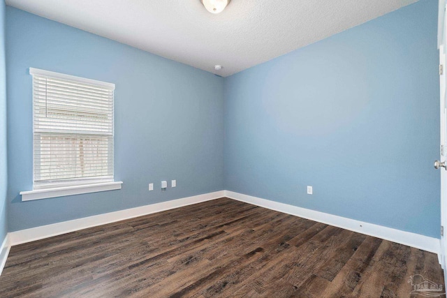 2748 Woodman Loop, Cantonment, FL 32533 - unfurnished room featuring dark wood-style flooring and baseboards