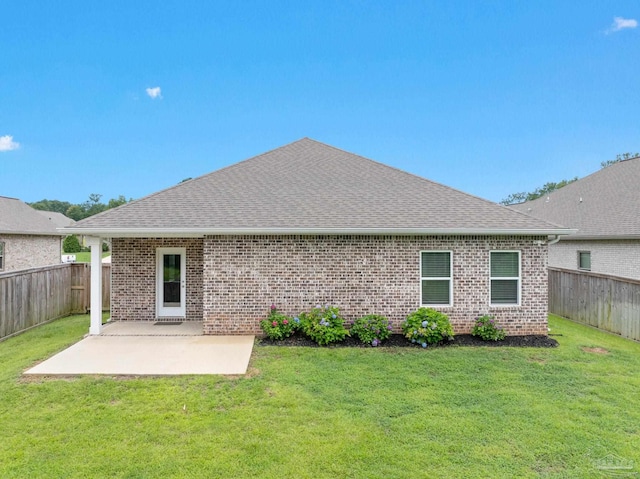 2748 Woodman Loop, Cantonment, FL 32533 - back of house with a patio area, brick siding, and a shingled roof
