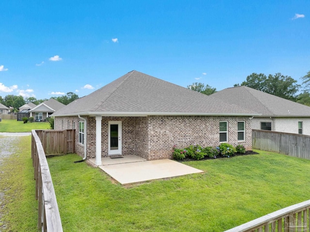 2748 Woodman Loop, Cantonment, FL 32533 - back of property with brick siding, roof with shingles, and a patio